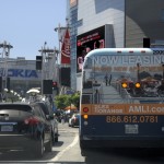 Los Angeles Downtown Bus Tail Fullback Billboard Ad for AMLI Lex on Orange as it drives by the Los Angeles Convention Center / LA Live / The Nokia Theatre